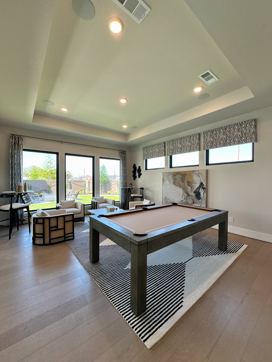 Game room with pool table, sliding doors, and lounge seating