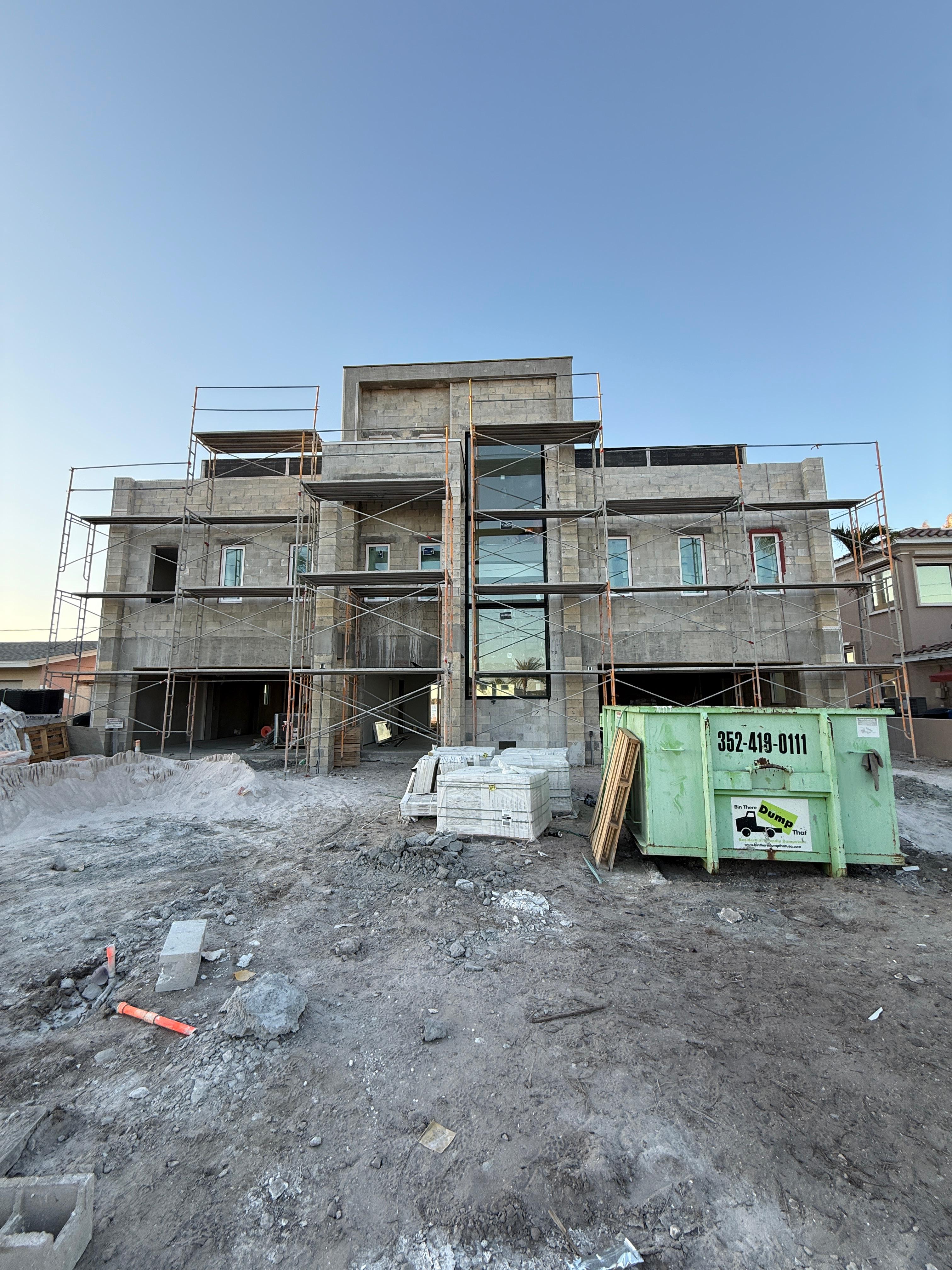 Scaffolding set up around CMU block walls during construction