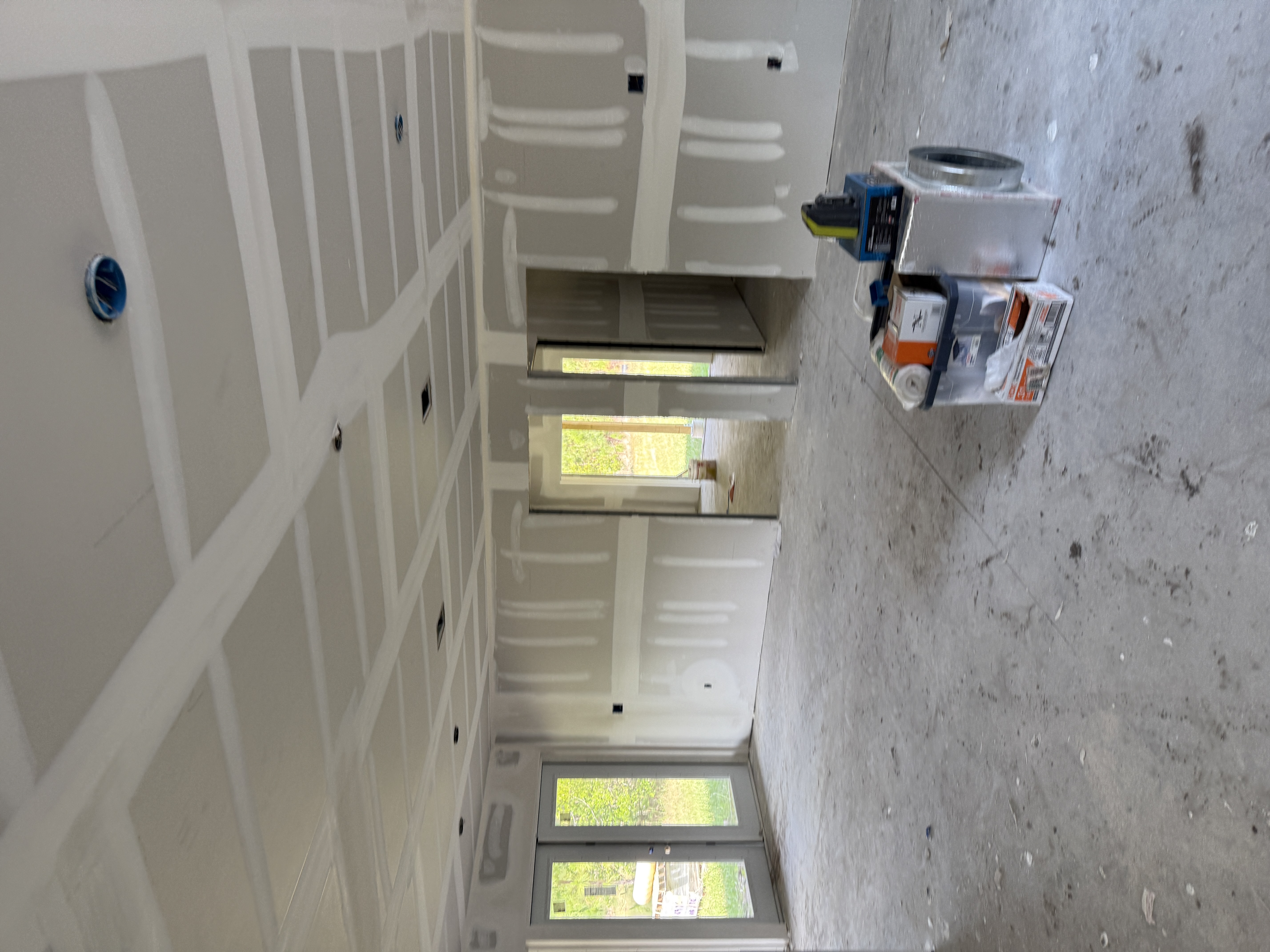 Drywall mudding and taping in progress