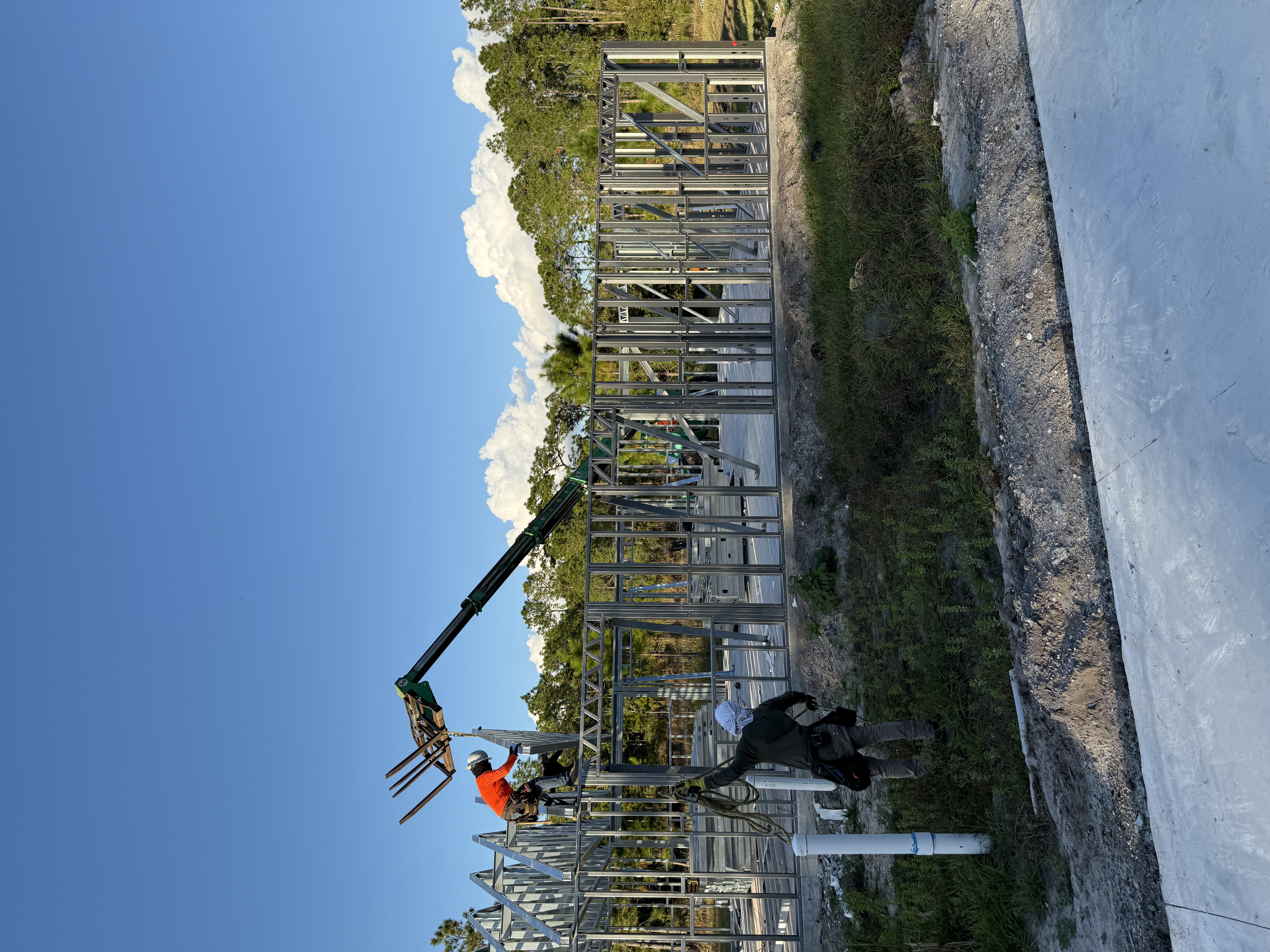 Roof trusses installed on custom home under construction