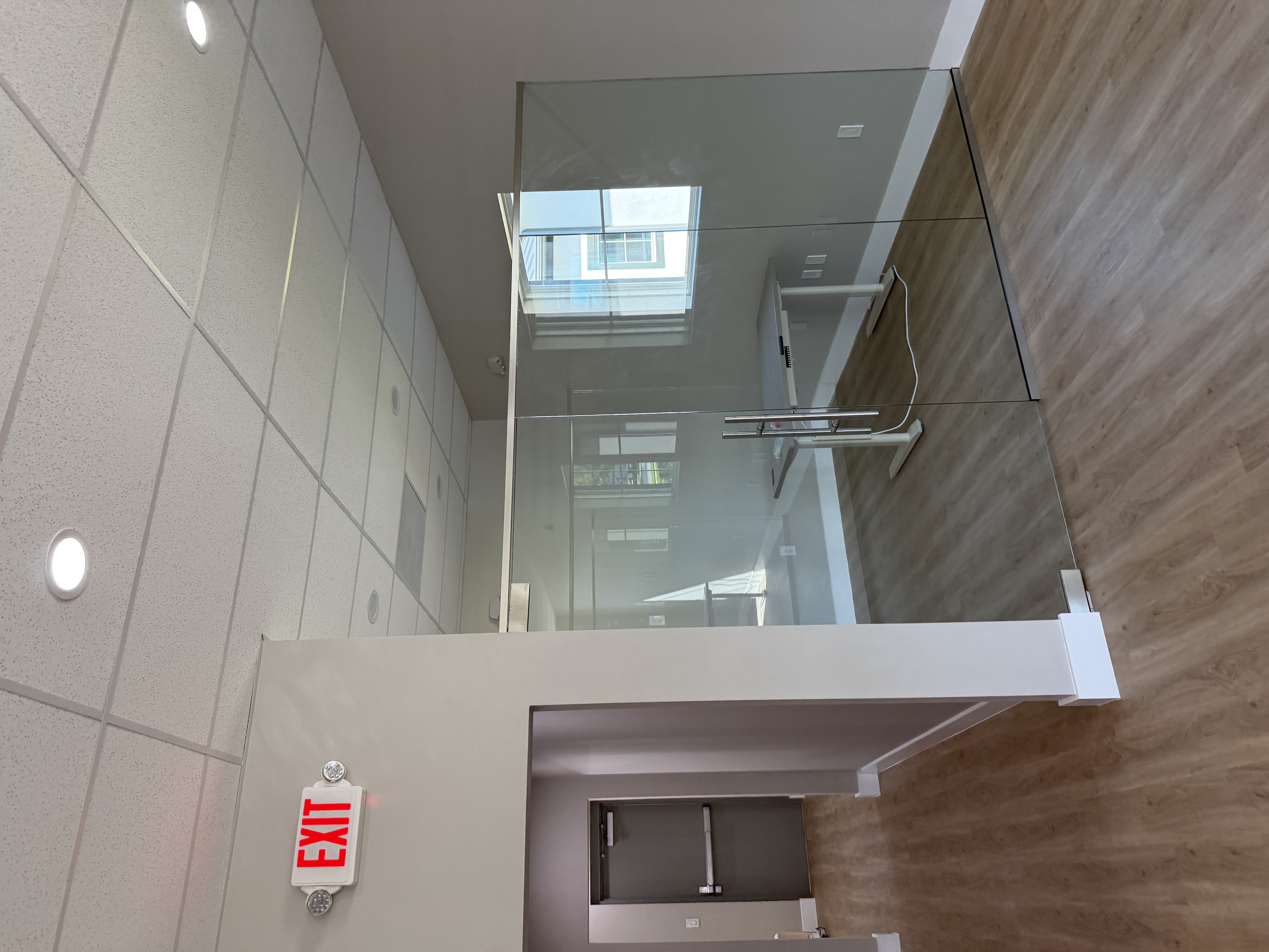 Second floor glass railing and skylight in custom home